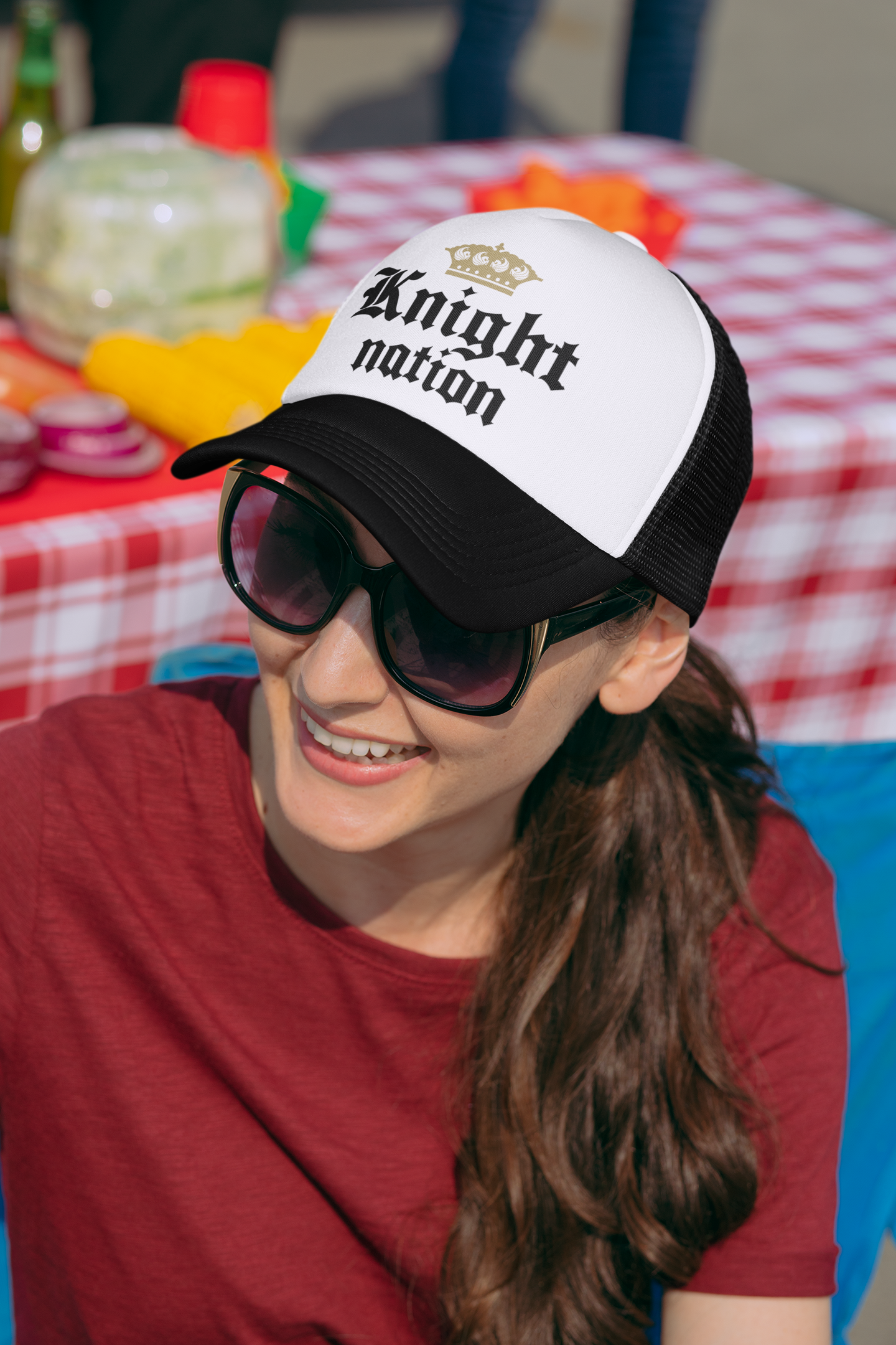 UCF fan wearing the stylish Knight Nation Trucker Hat showcasing Knight pride