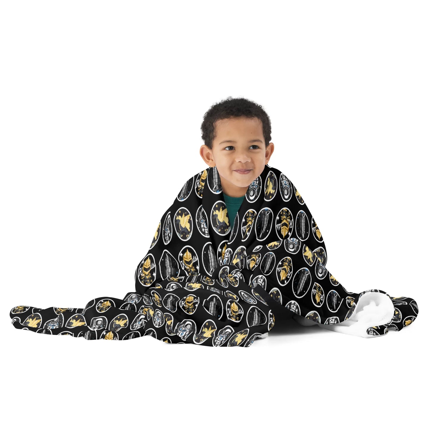 A young child wrapped in the Knights Fan Throw Blanket, cozy and content.